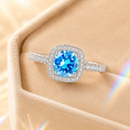 Ocean Blue Muse 2 Carat Cushion Halo Colored Moissanite Ring — styled still-life view