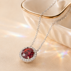 Red Aura 2 Carat Round Halo Colored Moissanite Necklace — styled still-life view