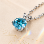 Aqua Blue Solis 1 Carat Three-Prong Colored Moissanite Necklace — close-up setting detail