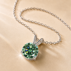 Green Solis 1 Carat Three-Prong Colored Moissanite Necklace — close-up setting detail